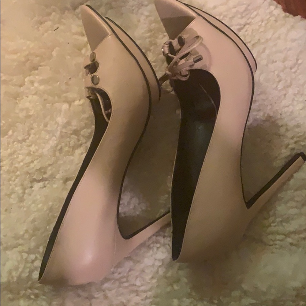 Nasty Gal used nude color open toe pumps.